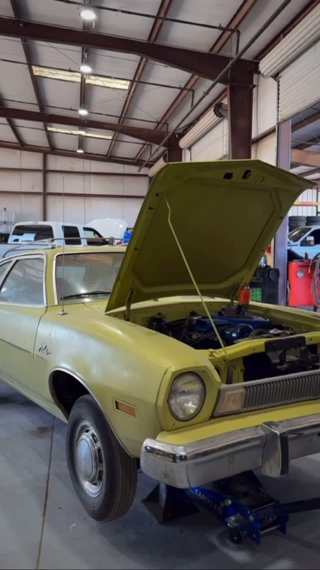 Hamilton Auto and Diesel shop - car with hood open on the lift